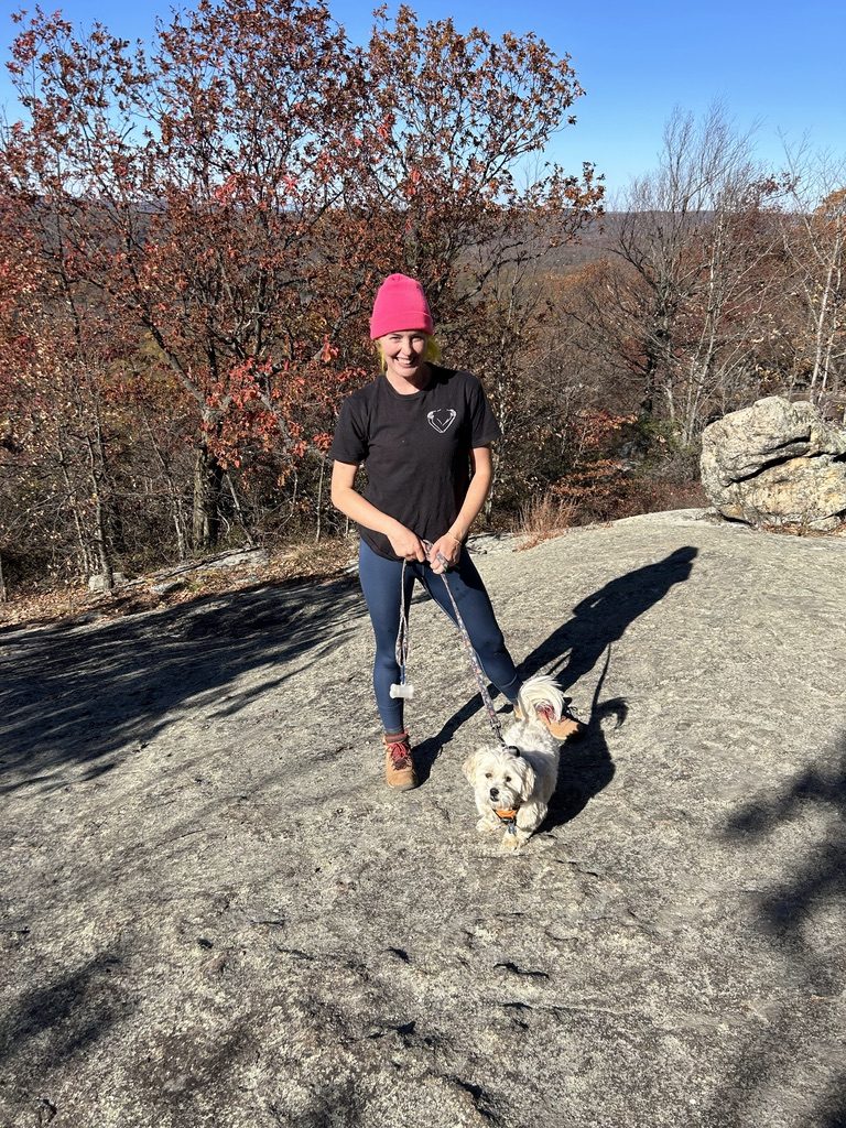 Britta and a dog hiking in autumn